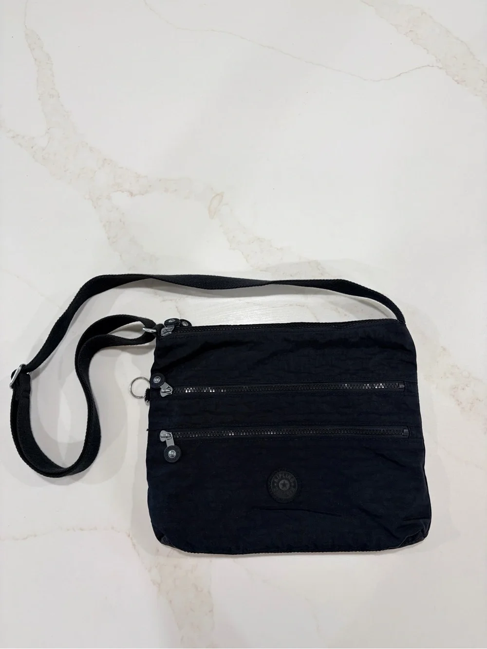 Kipling Black Compact Crossbody Bag with adjustable strap and 5 zipper pockets